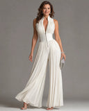 White sleeveless chiffon jumpsuit with V-neck, zipper, and pleated wide-leg pants